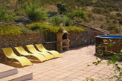 Barbecue area next to the swimming pool.