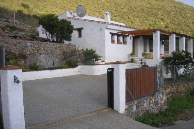 Gated driveway leading up to the house and front terrace.