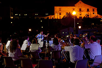 A night orchestra. An orchestra plays at night during one of the festivals.