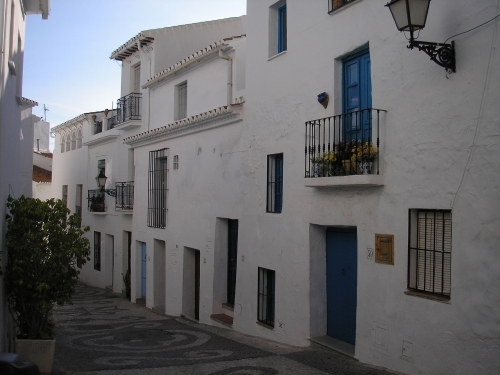 A typical row of houses along the main street and the idiosyncratic truth of their construction: houses were literally built one on top of the other.